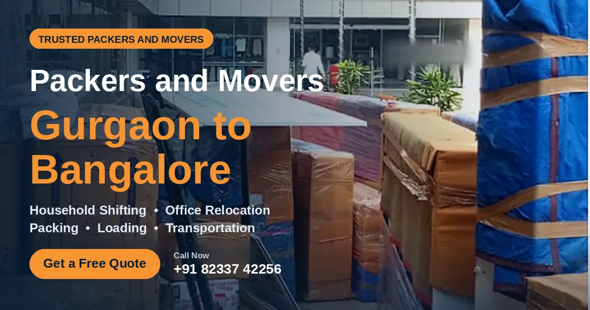 Cartons and blue-wrapped furniture stacked for loading by packers and movers Gurgaon to Bangalore