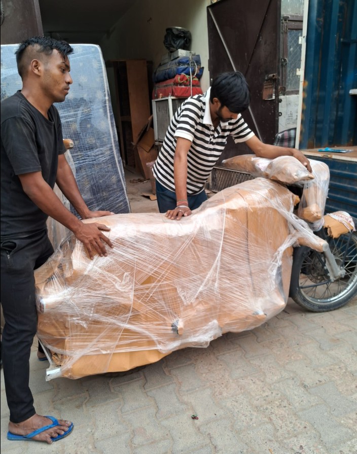Trusted Packers and Movers securely packing a two-wheeler for damage-free transportation.