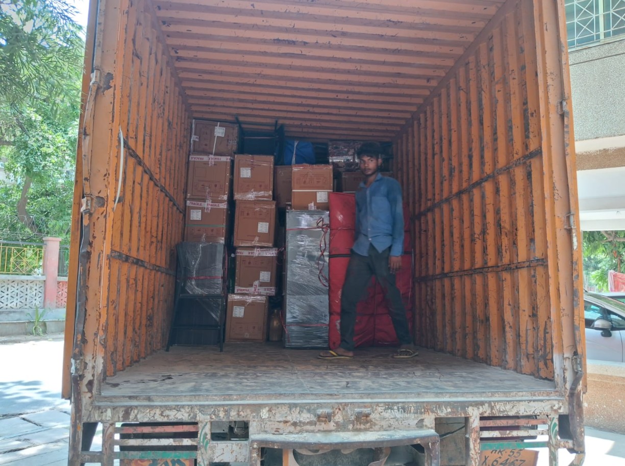 Household goods securely loaded into transport truck by Trusted Packers and Movers.